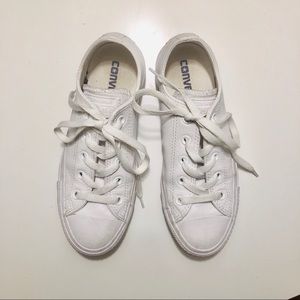 All white leather Converse Chuck Taylor low tops.